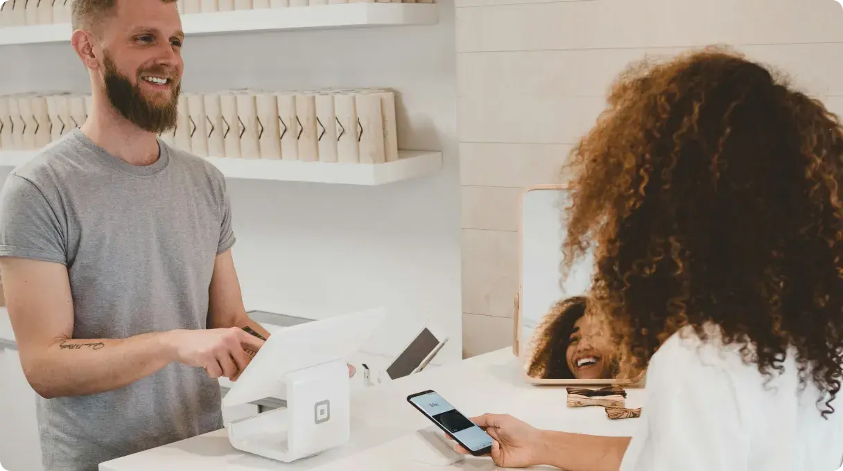 Two People Making A Purchase Transaction