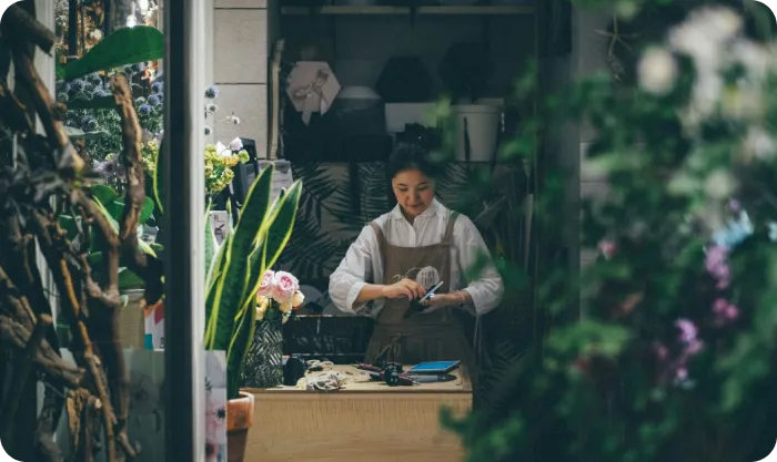 Woman Working In Flower Shop